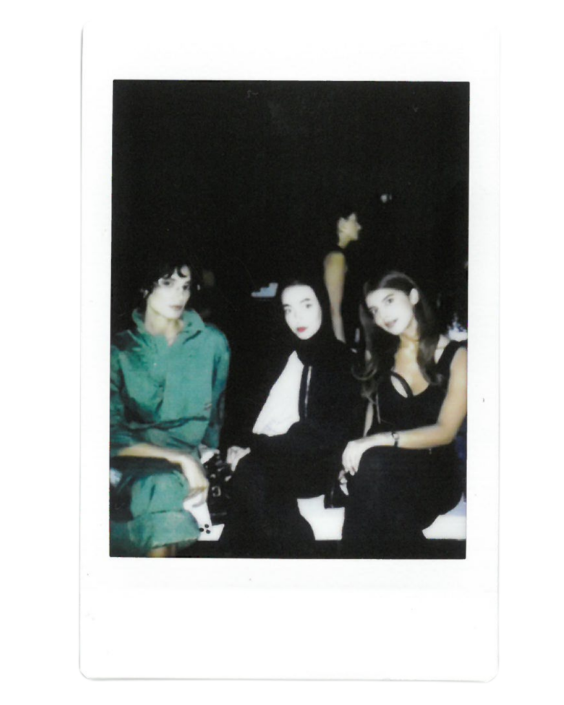 Leena poses in a black hijab and a white dress shirt 