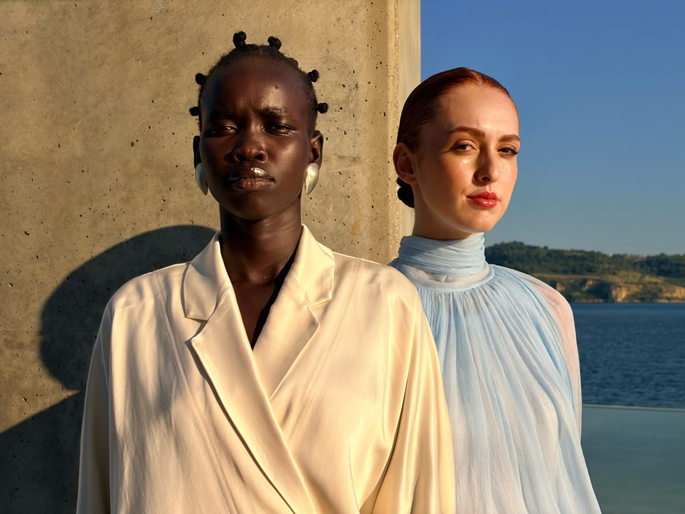 two models with contrasting skin pose in the sun, the iphone air camera is able to capture both